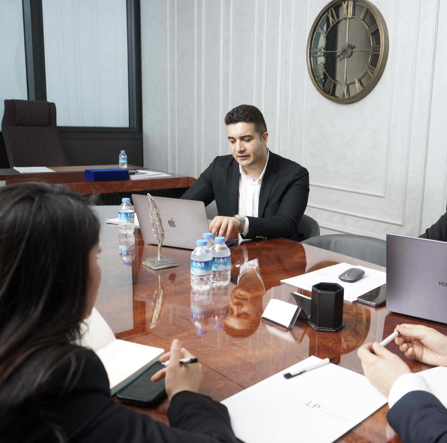 Selahattin Hakan Yıldırım working at the meeting table in the LP Legal office